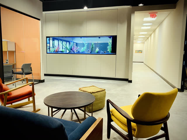 Lounge beside the aquarium wall